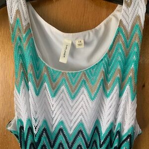 Floor length summer dress and crocheted sweater wrap.